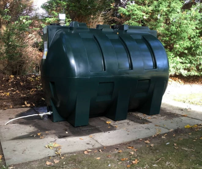 Dark Green Plastic Tank Installation On Concrete