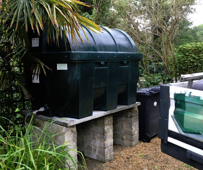 Bunded oil tank positioned outdoors