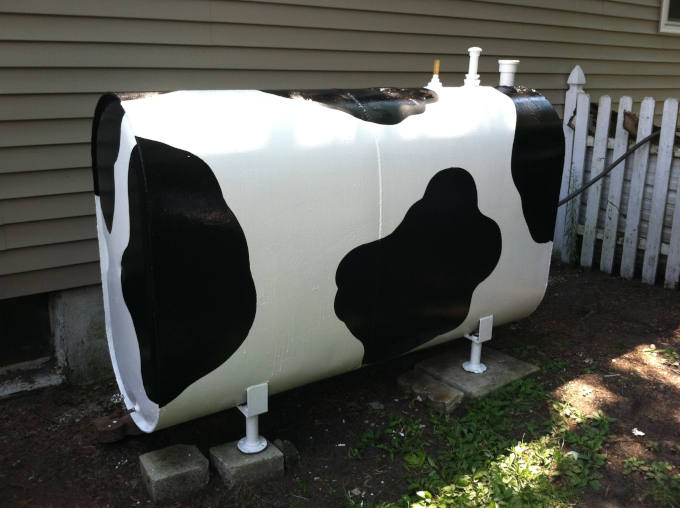 Cow-covered-oil-tank